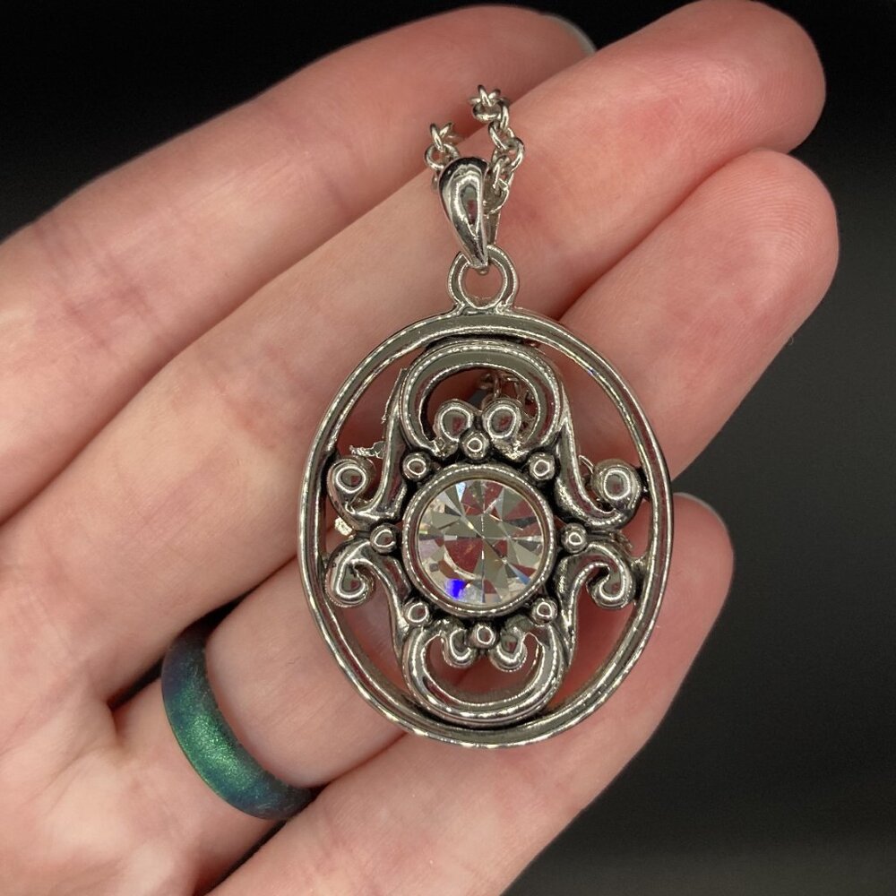 Light-Catching Pendant with Large Faux Gem and Silver Tone Scrollwork - Signed